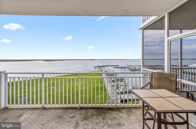 balcony featuring a water view