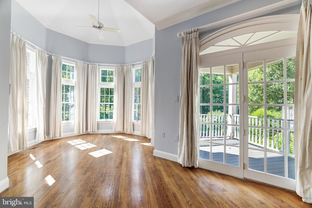 entryway featuring crown molding, ceiling fan, and wood-type flooring