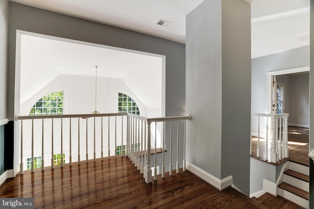 hallway with dark wood-type flooring