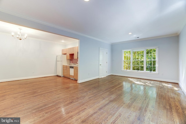 unfurnished living room with wood-type flooring and crown molding