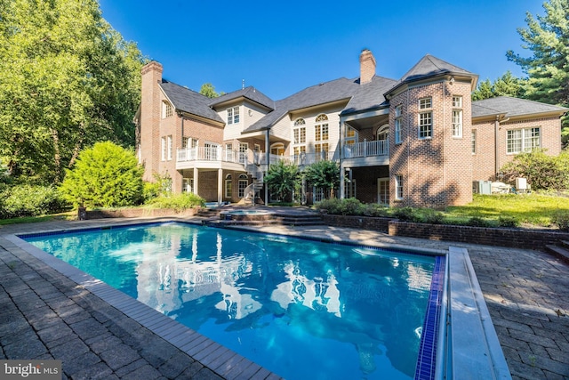 view of swimming pool with a patio area