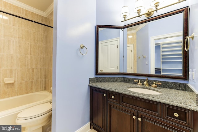 full bathroom featuring tiled shower / bath, toilet, crown molding, and vanity