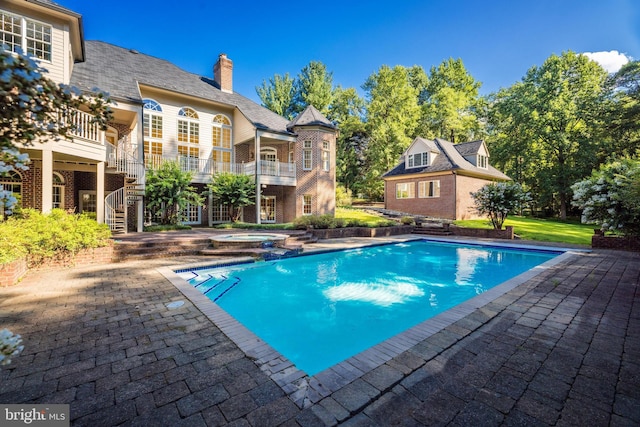 view of pool featuring a patio area