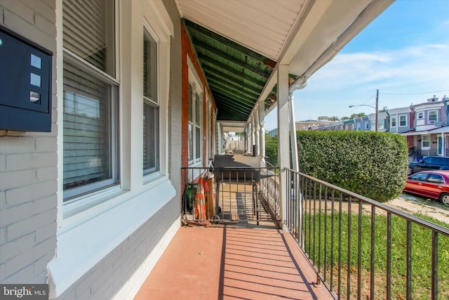 balcony featuring a porch