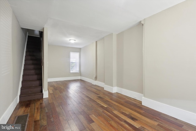 spare room featuring dark hardwood / wood-style floors