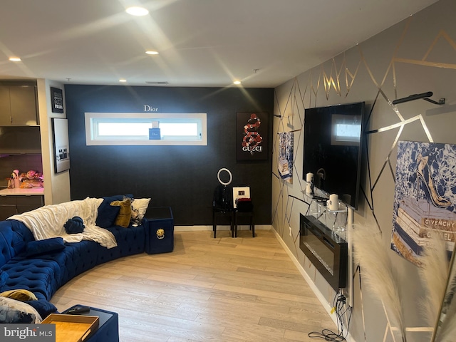 living room with light hardwood / wood-style flooring