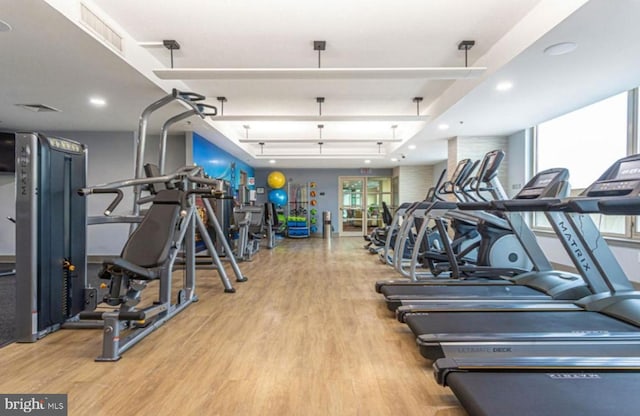 gym featuring light wood-type flooring