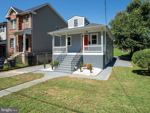 bungalow-style house with a porch and a front lawn