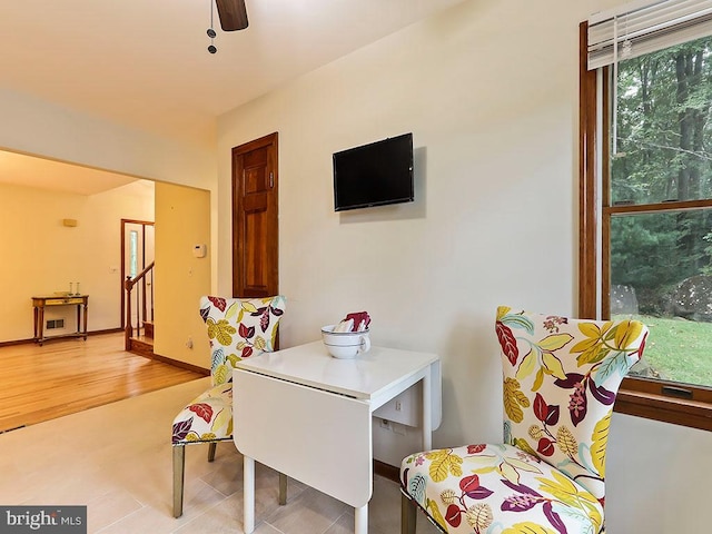 playroom with ceiling fan and light wood-type flooring