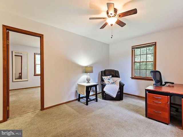 carpeted office with ceiling fan