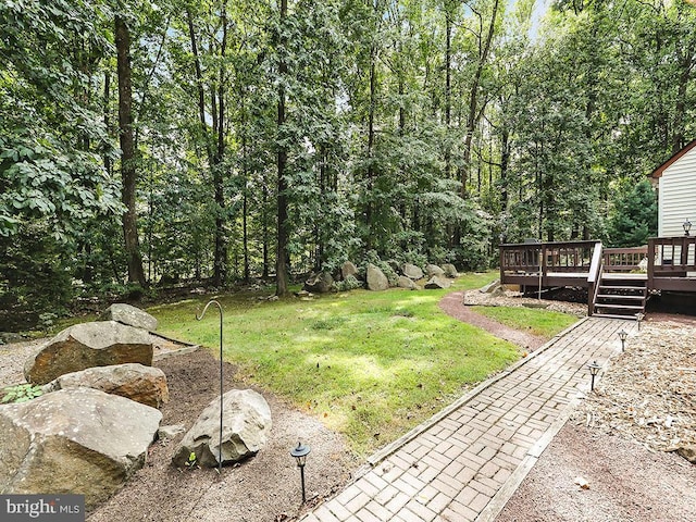 view of yard featuring a wooden deck