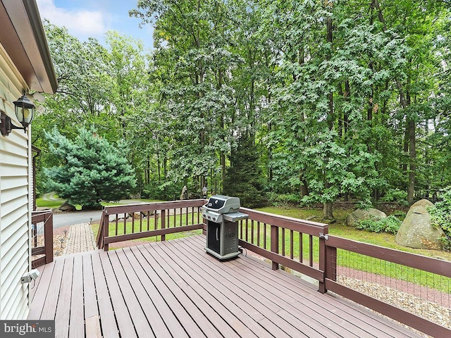 wooden terrace featuring grilling area