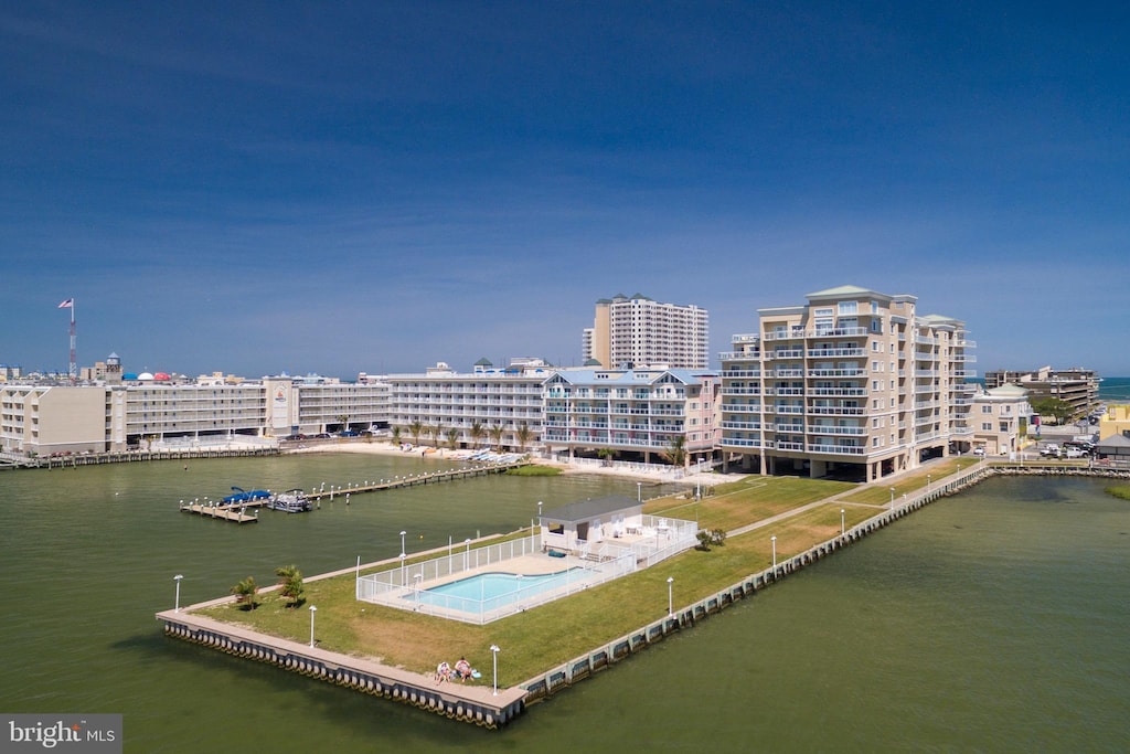 bird's eye view featuring a water view and a city view