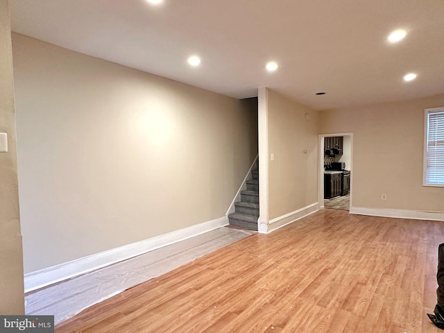 basement featuring light hardwood / wood-style flooring