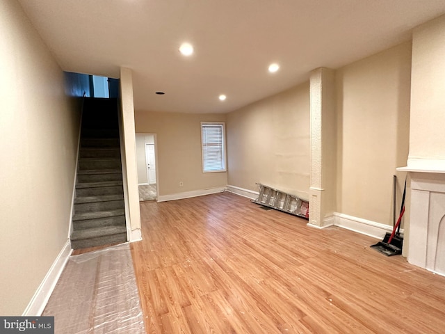 unfurnished living room with light wood-type flooring