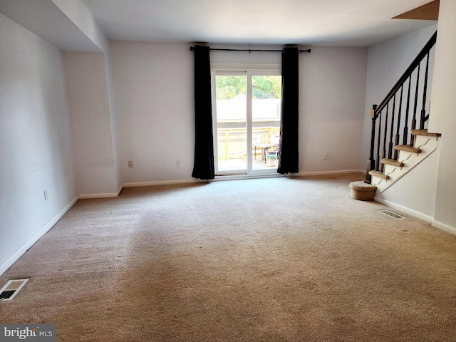 unfurnished living room with carpet