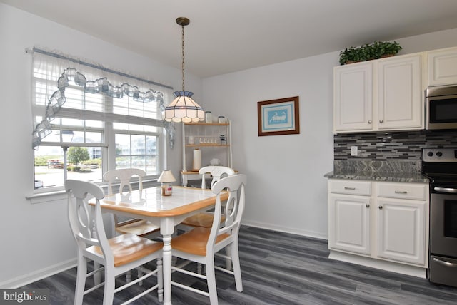 dining area featuring dark hardwood / wood-style floors