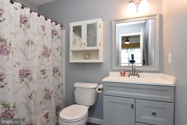 bathroom with toilet and vanity