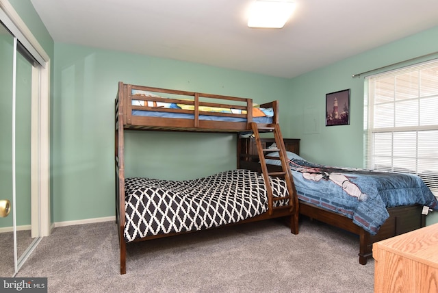 carpeted bedroom with a closet