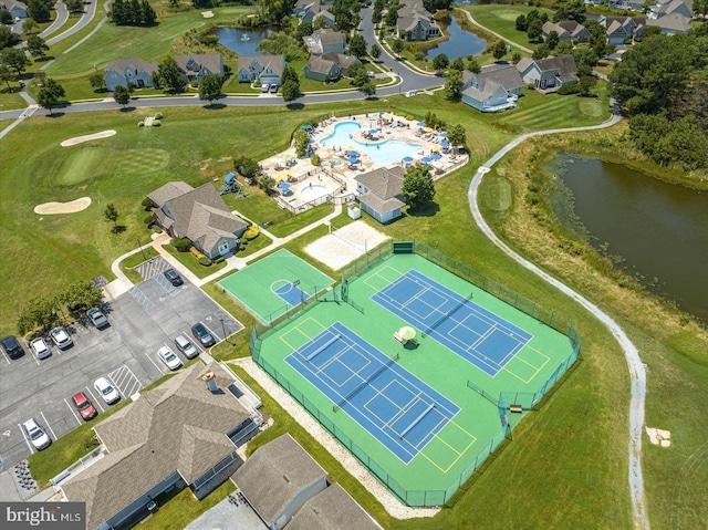 birds eye view of property with a water view