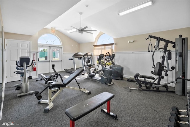 gym featuring a wealth of natural light, ceiling fan, and lofted ceiling