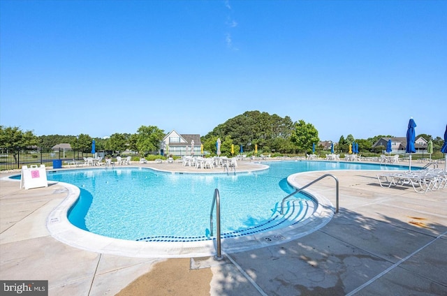 view of swimming pool with a patio