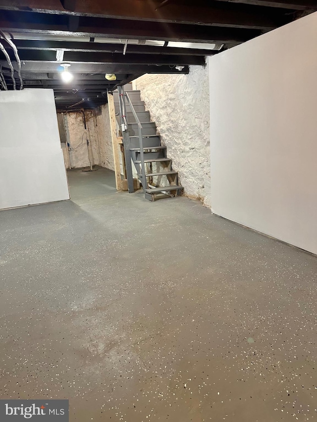 unfinished basement with stairway