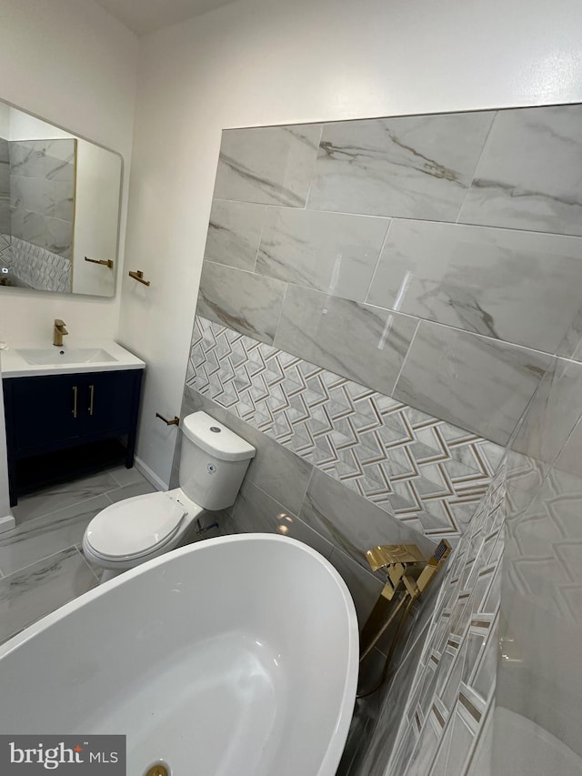 bathroom featuring vanity, tile walls, toilet, and backsplash