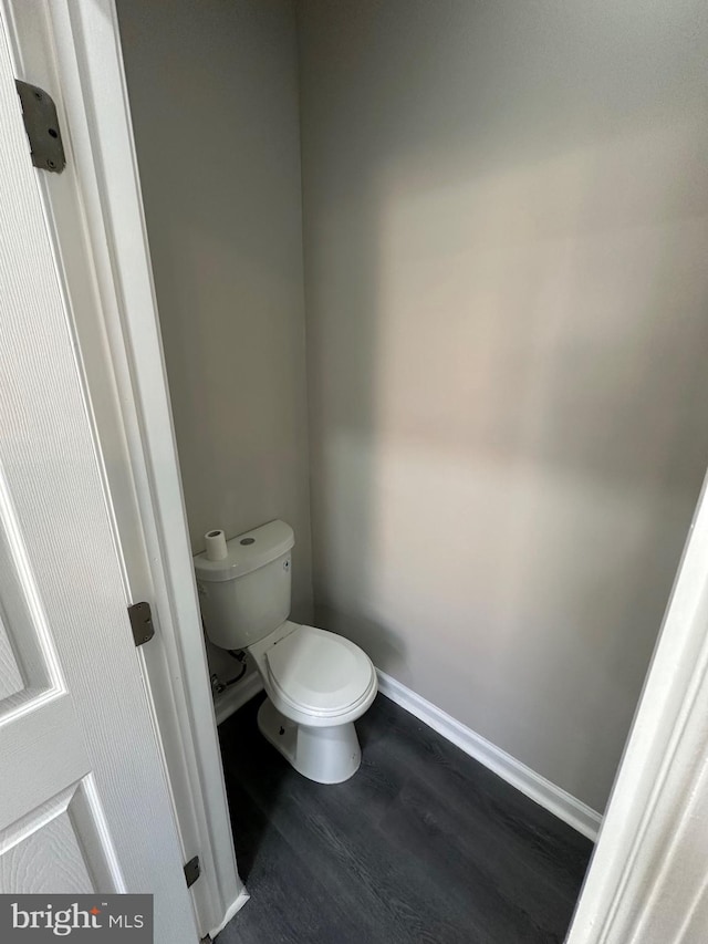 bathroom featuring toilet and hardwood / wood-style floors