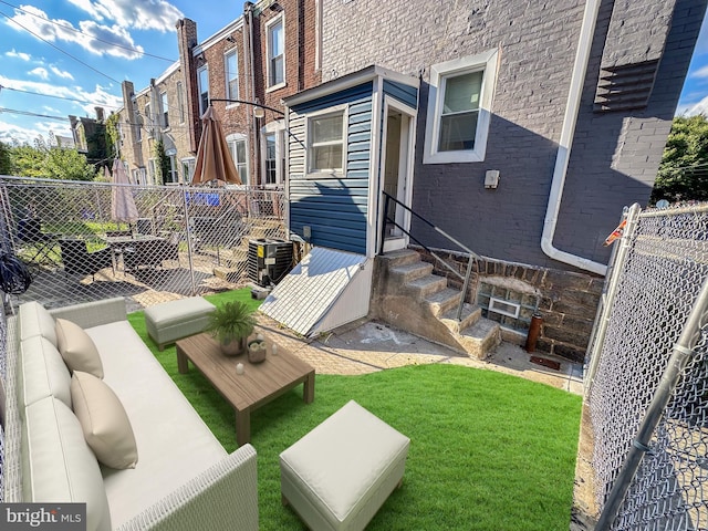 exterior space featuring cooling unit and an outdoor living space