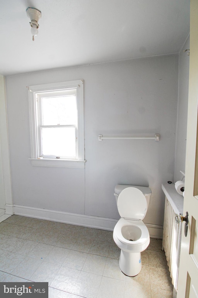 bathroom featuring tile patterned floors and toilet