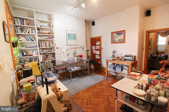 office space featuring track lighting and dark parquet floors