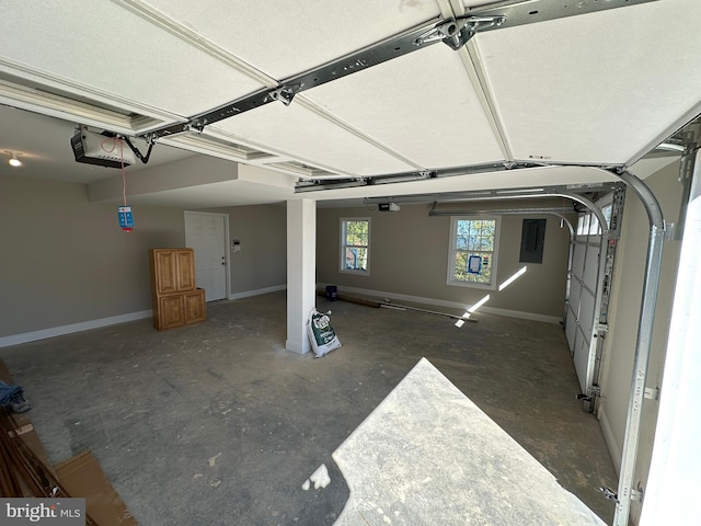 garage featuring baseboards and a garage door opener