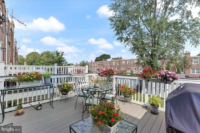 wooden terrace featuring area for grilling