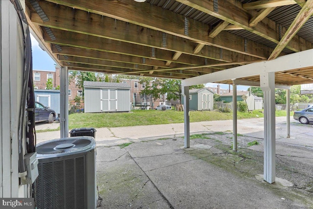 view of patio / terrace featuring central AC and a shed