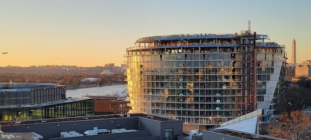 view of outdoor building at dusk