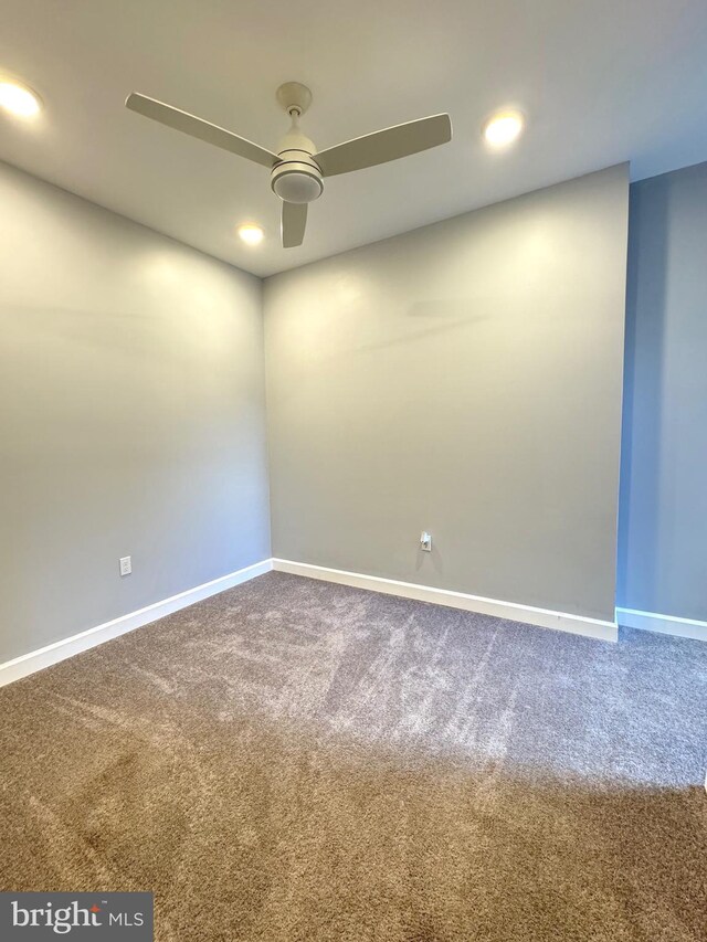 empty room with recessed lighting, ceiling fan, baseboards, and carpet