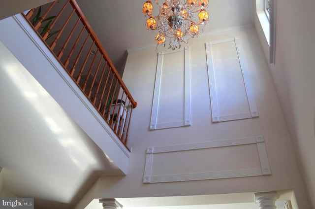 stairs featuring crown molding