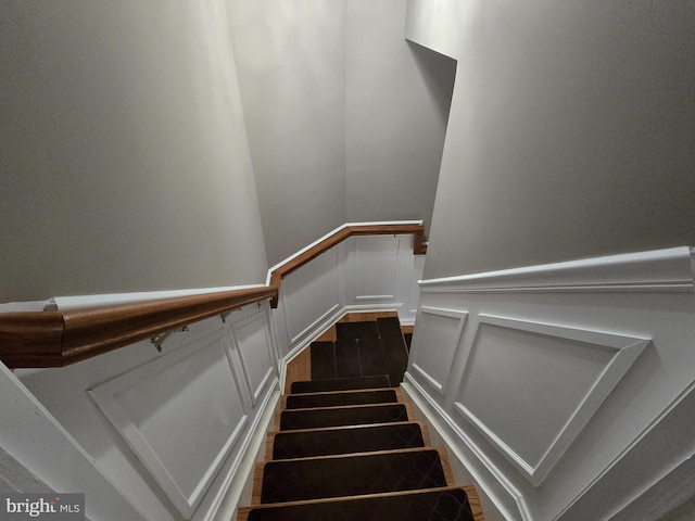 stairs with hardwood / wood-style flooring