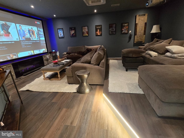 home theater room with wood-type flooring