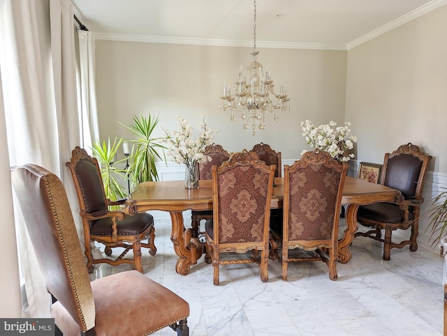 dining area with ornamental molding and a notable chandelier