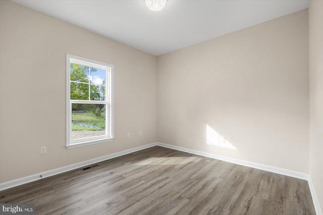 empty room featuring hardwood / wood-style flooring