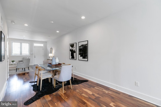 dining space with hardwood / wood-style flooring