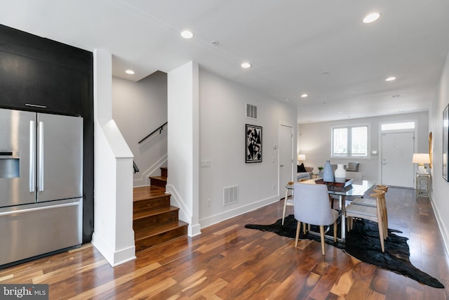 dining space featuring wood-type flooring