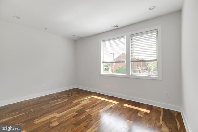 empty room featuring dark hardwood / wood-style floors