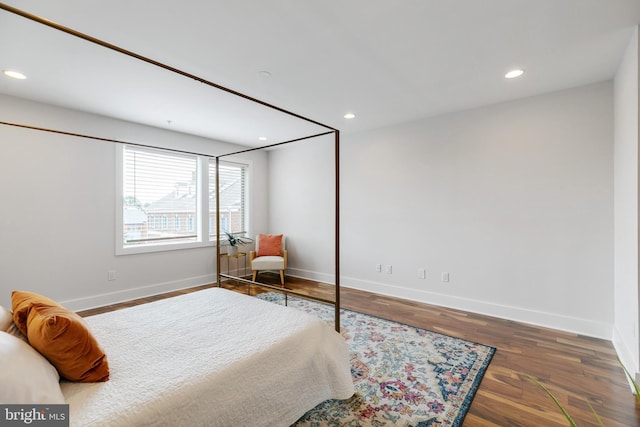 bedroom featuring dark wood-type flooring