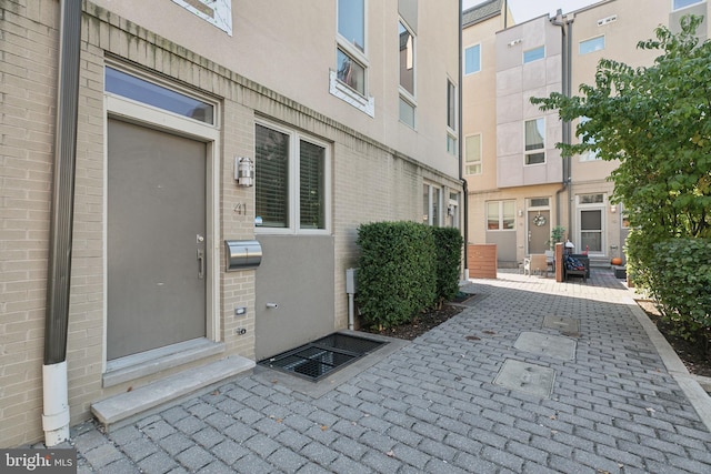 entrance to property featuring a patio area