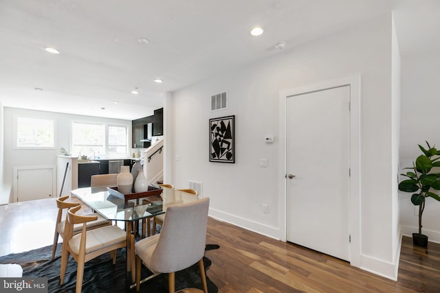 dining area with dark wood-type flooring