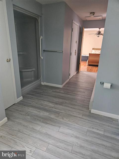 hallway featuring light wood-type flooring