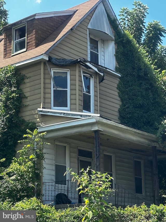 view of property exterior featuring a porch